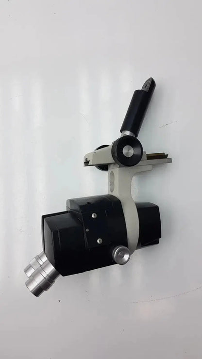 Black and silver Reichert stereo star zoom microscope with adjustable arm and 1X to 6X objective lenses