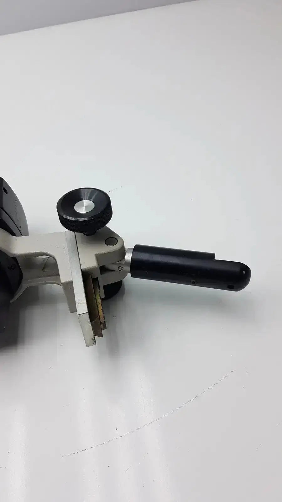 Black and gray handheld laser cutter with rotating adjustment knob for reichert stereo star zoom microscope use
