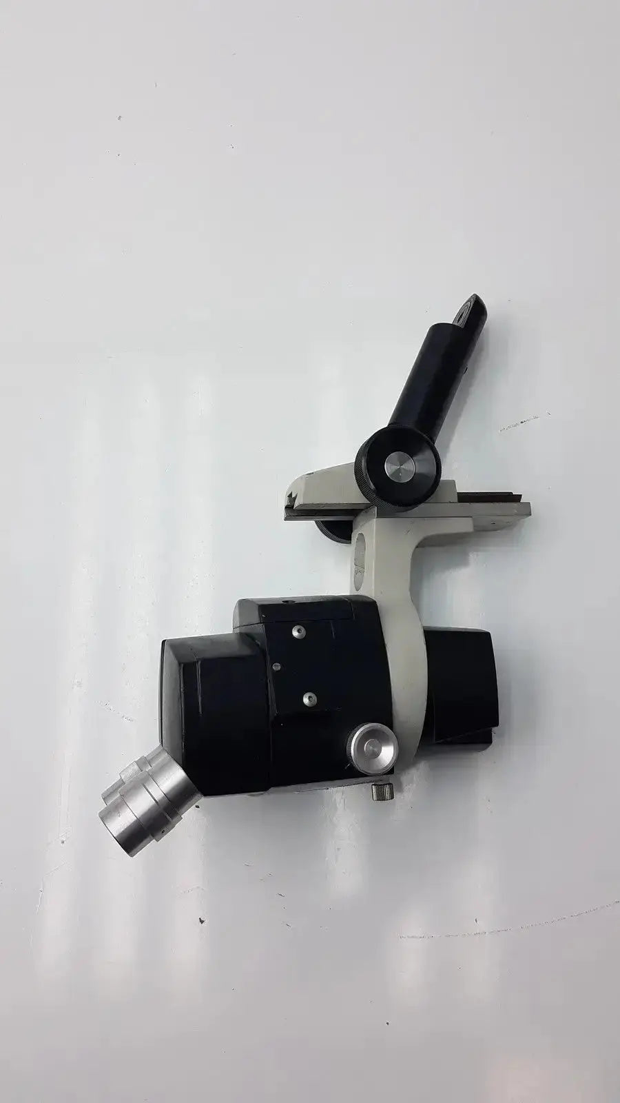 Black and silver Reichert stereo star zoom microscope with adjustable arm and 1X to 6X zoom objective lens