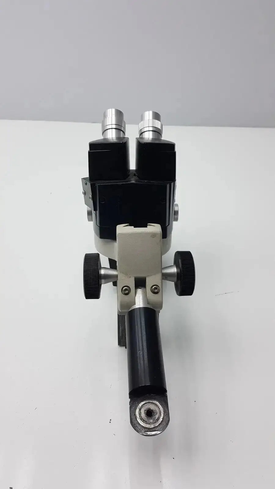 Black and silver reichert stereo star zoom microscope with dual eyepieces and adjustable focus knobs on sturdy base
