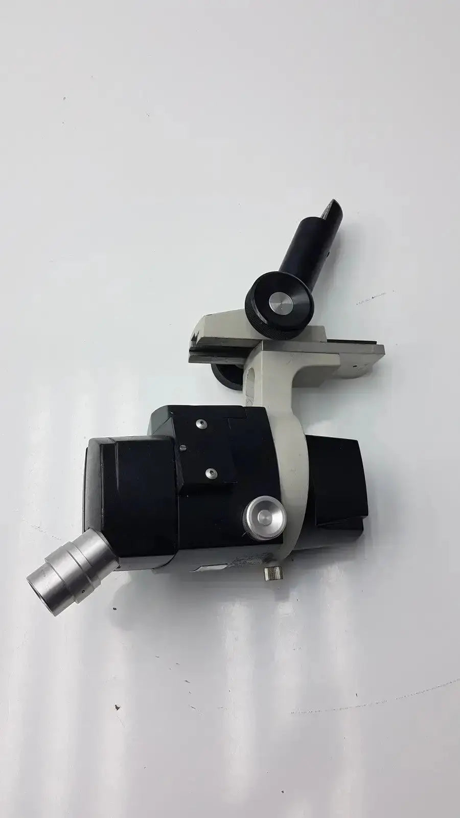 Black and silver Reichert stereo star zoom microscope with adjustable arm and 1X to 6X objective lens for precision viewing