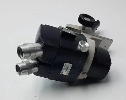 Black and silver reichert stereo star zoom microscope with dual eyepieces and adjustable focus knobs for precision viewing
