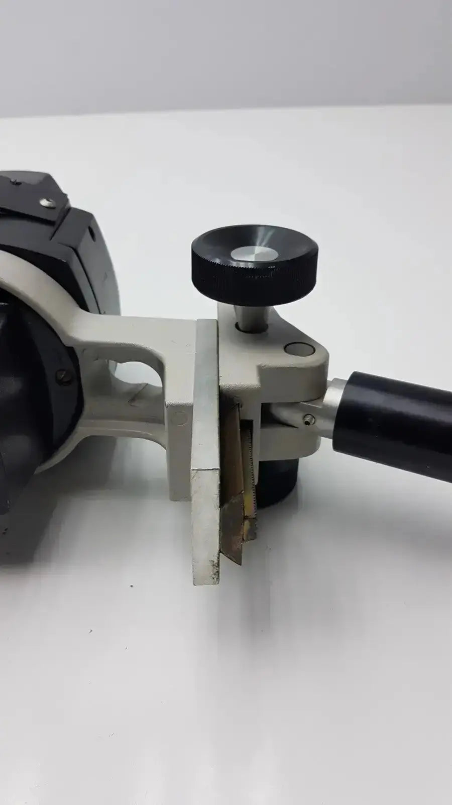 Black and silver metal caliper with black handle and knob for reichert stereo star zoom microscope 1x to 6x zoom use
