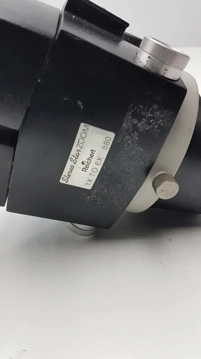 Black reichert stereo star zoom microscope objective lens with silver adjustment knobs and 1x to 6x magnification label
