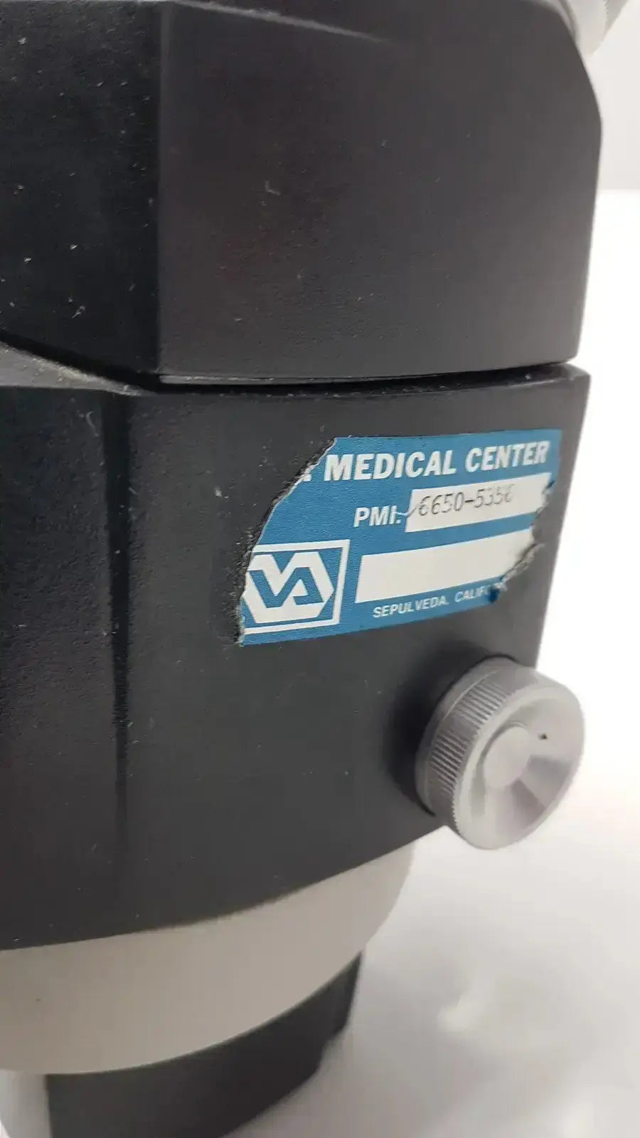Black medical-grade reichert stereo star zoom microscope 1x to 6x with va logo from Sepulveda medical center California