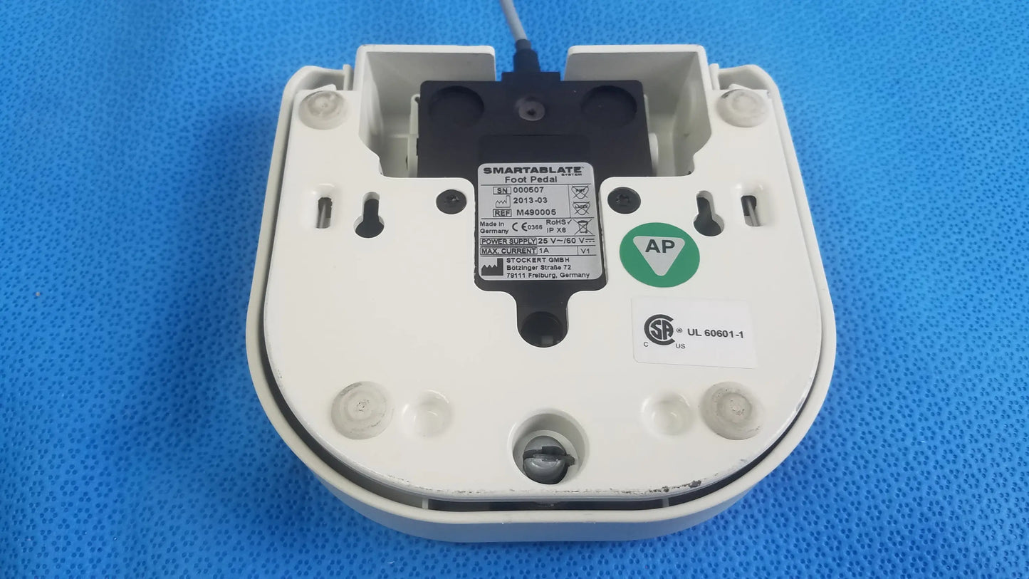 White plastic Stokert SmartAblate food probe with black sensor and labeling stickers for medical equipment foot pedal ref use