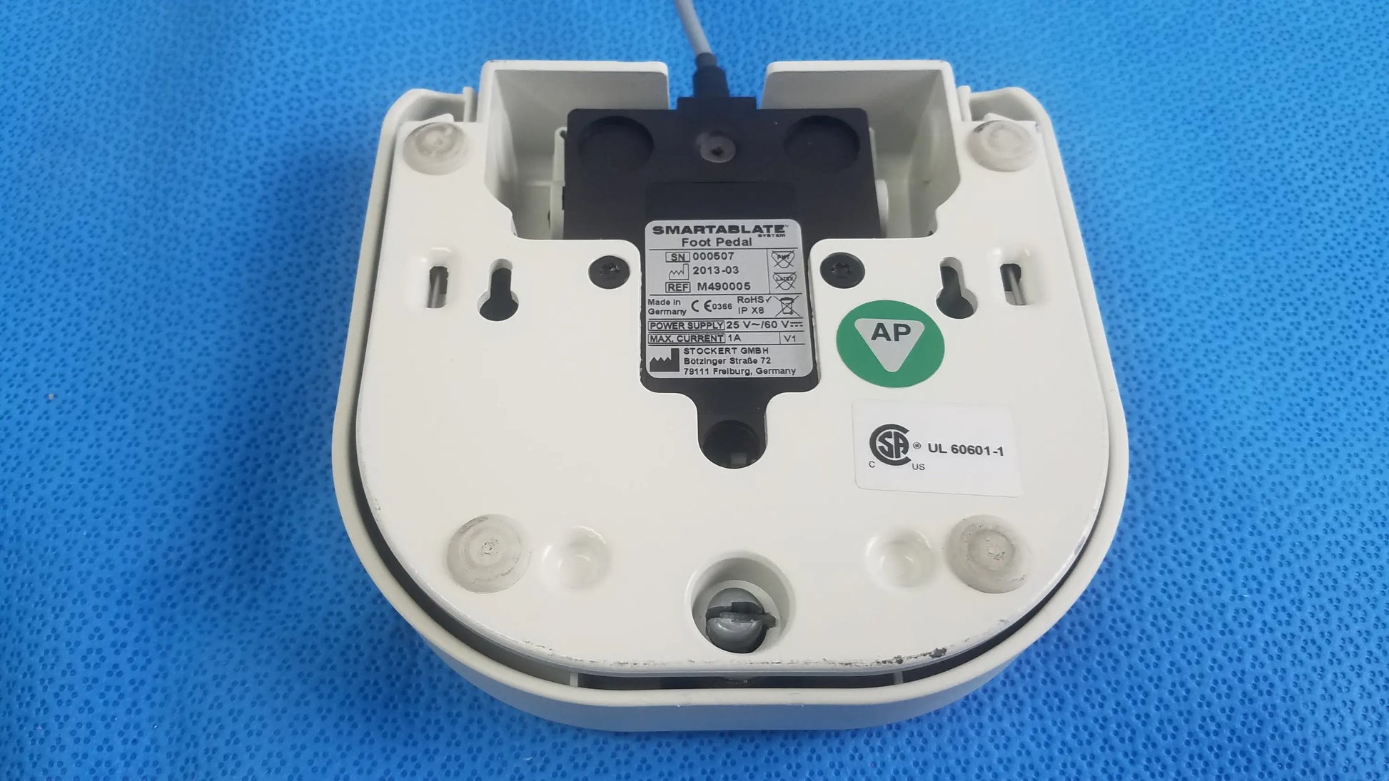 White plastic Stokert SmartAblate food probe with black sensor and labeling stickers for medical equipment foot pedal ref use