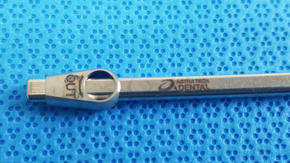 Silver metallic Straumann ultrasonic cleaning cassette torque wrench with engraved austratech dental branding for reuse medical equipment