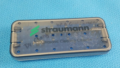 Transparent straumann ultrasonic cleaning cassette with metal frame and circular holes for reuse medical equipment cleaning