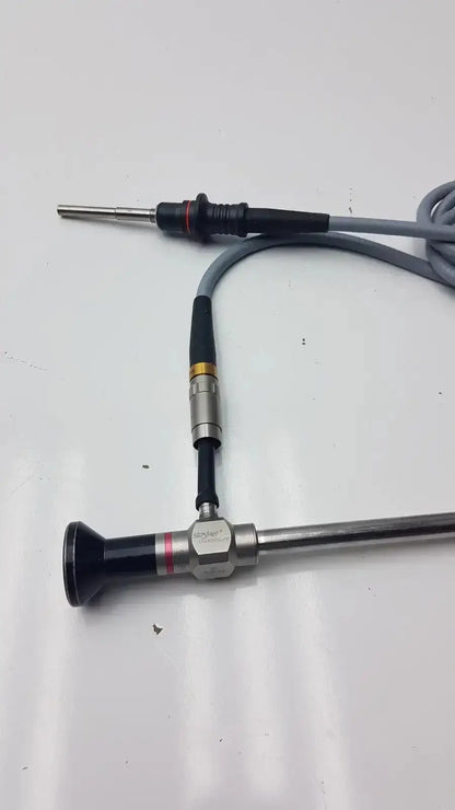 Stryker 0º 380-10 autoclavable laparoscope with olumpus germany a3293 featuring black silver body and flexible gray cable