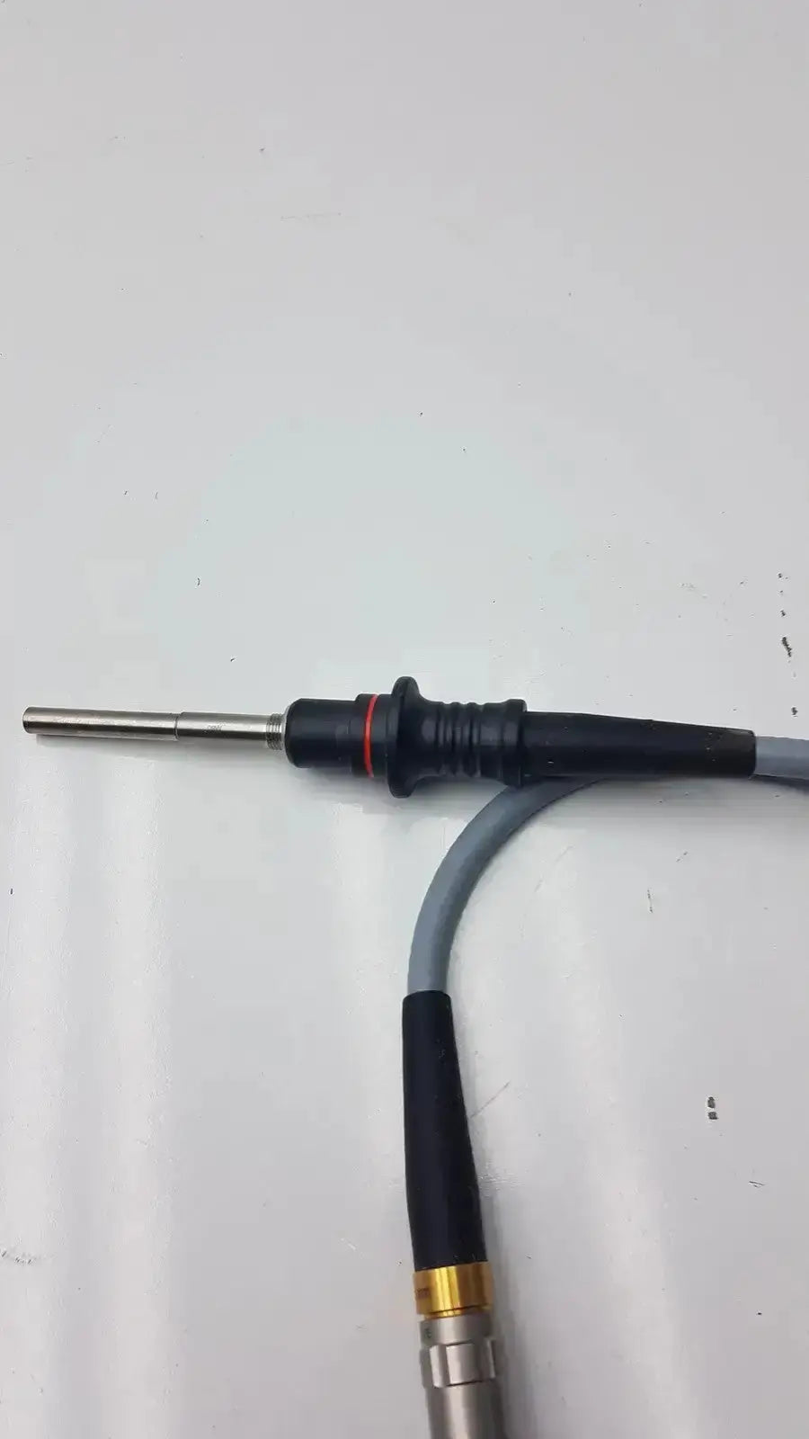 Black and silver welding electrode with textured grip and red accent ring near tip for olumpus germany a3293 autoclavable laparoscope