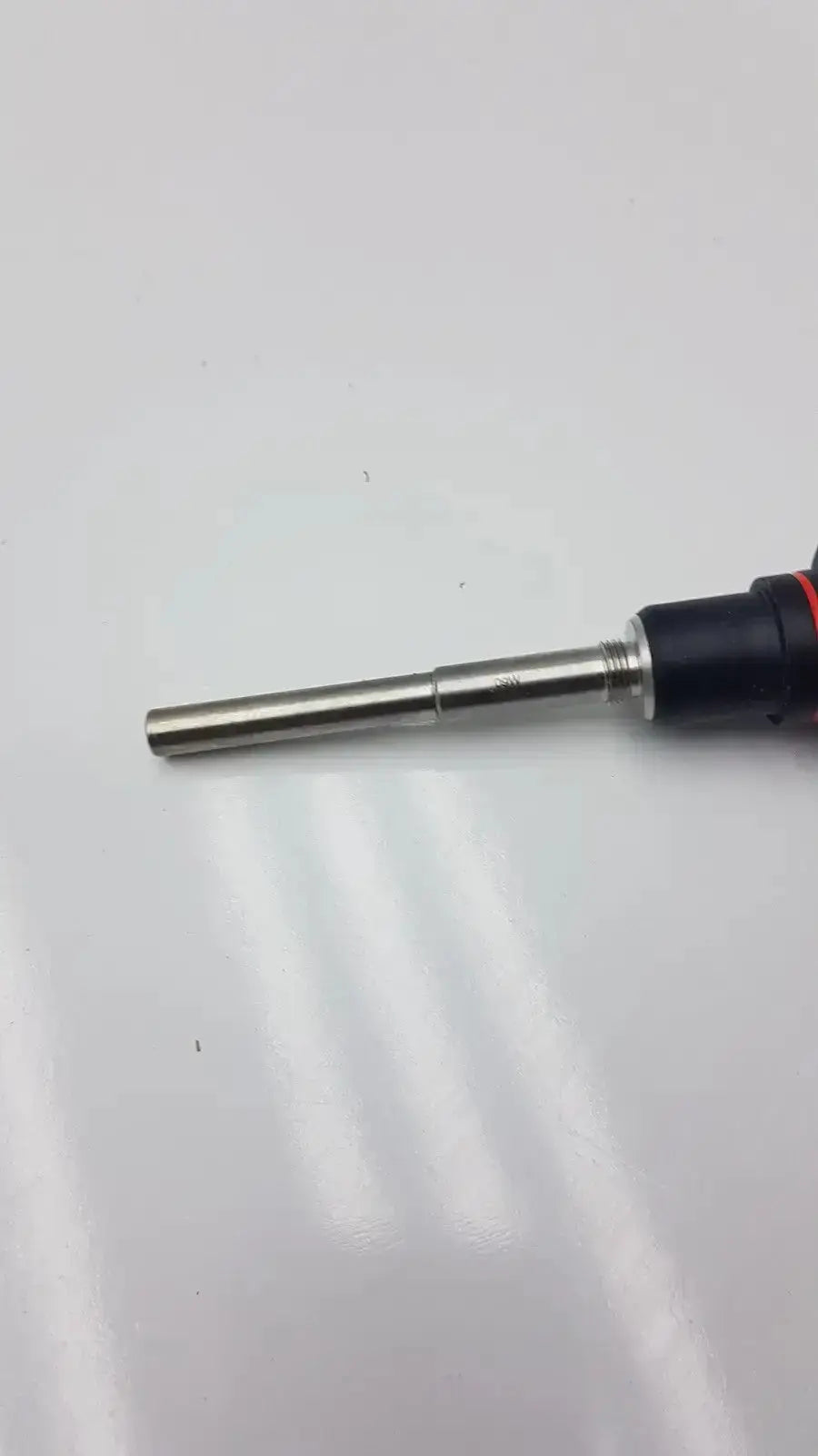 Black and red-handled screwdriver with metallic shaft for olumpus germany a3293 autoclavable laparoscope assembly