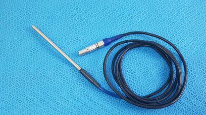 Black coiled cable with blue connector and metallic electrode probe for stryker lightweight sterilization box medical equipment