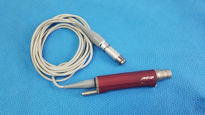 Red and gray Stryker 290-601-100 TPS Leibinger Hummer shaver handpiece with coiled white cable for surgical use