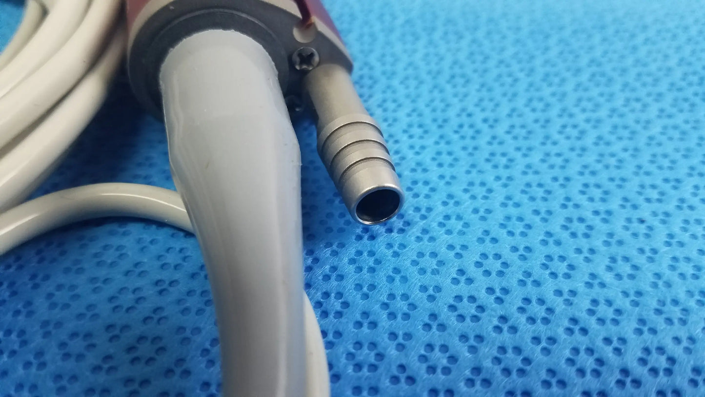 Gray shaver handpiece with metallic connector and white tubing for tps leibinger hummer surgical use