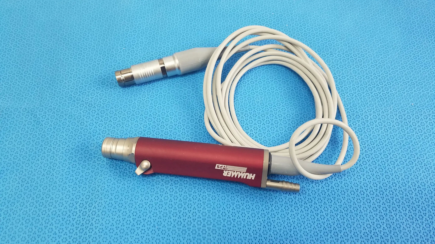 Red and silver tps leibinger hummer shaver handpiece with coiled white cable for precise surgical use
