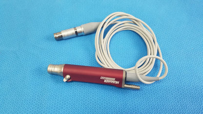 Red and silver tps leibinger hummer shaver handpiece with coiled white cable for precise surgical use