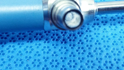 Blue cylindrical vape pen with metallic mouthpiece and glass chamber displayed alongside ideal eyes 5mm medical equipment