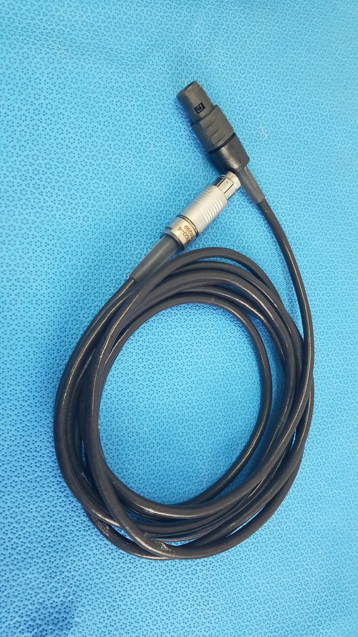 Black coiled Stryker 5100-4 scher handpiece cable with black and silver connector for reuse medical equipment