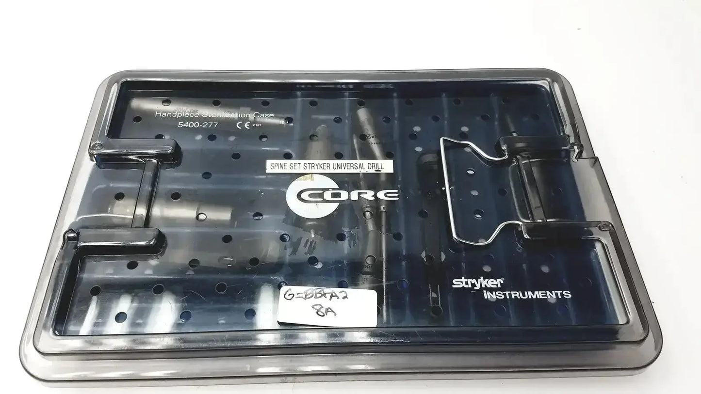 Black plastic core sterilization case with labeled compartments holding spinal drill components by Stryker