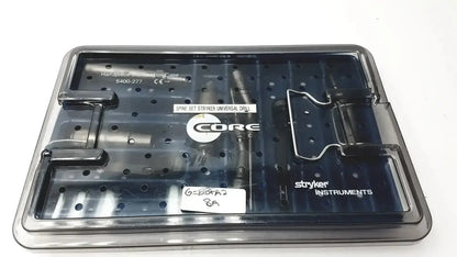 Black plastic core sterilization case with labeled compartments holding spinal drill components by Stryker