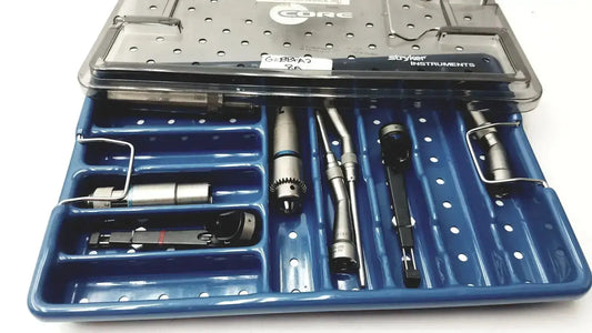 Blue plastic stryker 5400-277 core sterilization case with stainless steel tools and perforated metal lid for core sterilization