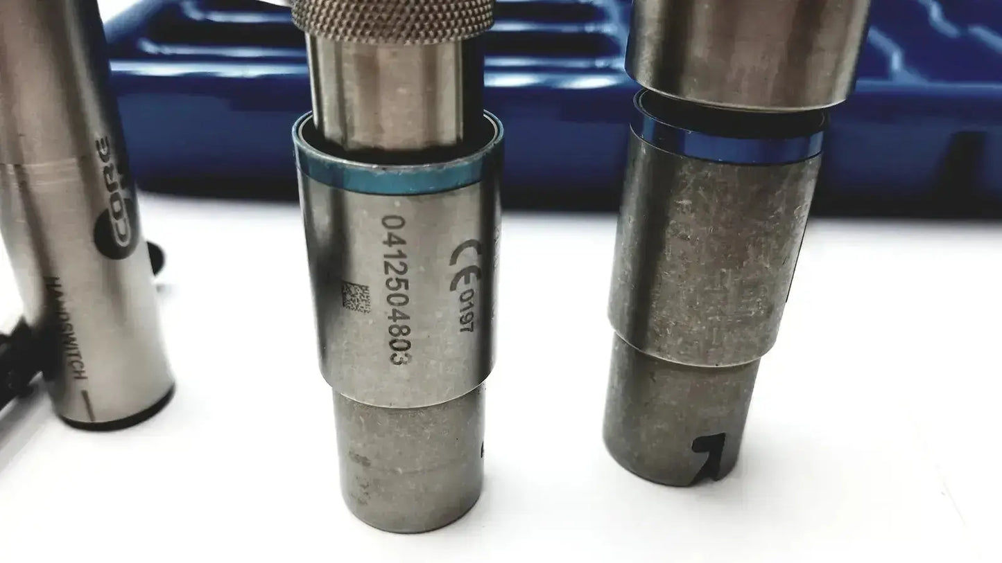 Silver metallic cylindrical tool with knurled top and blue ring for core sterilization case by Stryker 5400-277