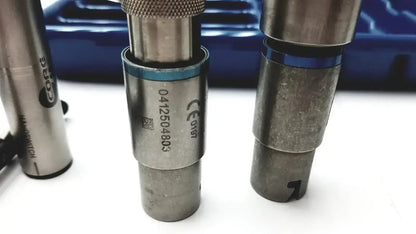 Silver metallic cylindrical tool with knurled top and blue ring for core sterilization case by Stryker 5400-277
