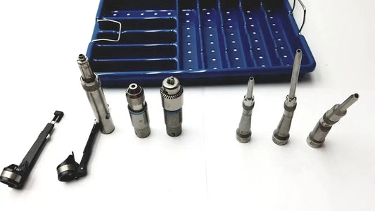 Set of surgical drill bits and handpiece components arranged with blue storage tray for stryker 5400-277 core sterilization case
