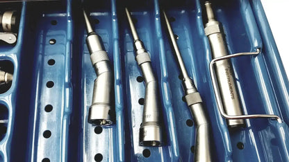 Set of four metallic dental instruments with textured grips in a blue stryker 5400-277 core sterilization case