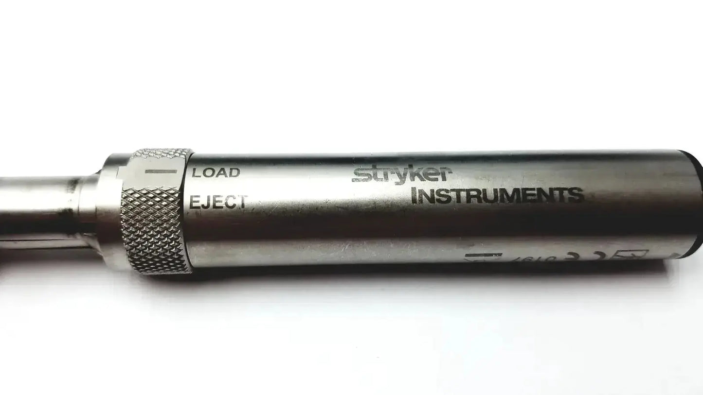 Silver metallic surgical instrument with textured grip and engraved stryker instruments branding for core sterilization case