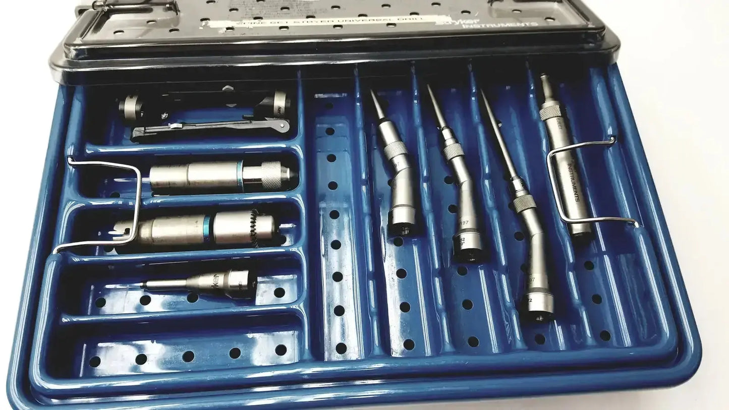 Blue plastic stryker 5400-277 core sterilization case with metallic dental handpieces and drill attachments