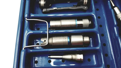Blue plastic tray holding metallic tool bits with knurled grips in stryker 5400-277 core sterilization case for core sterilization