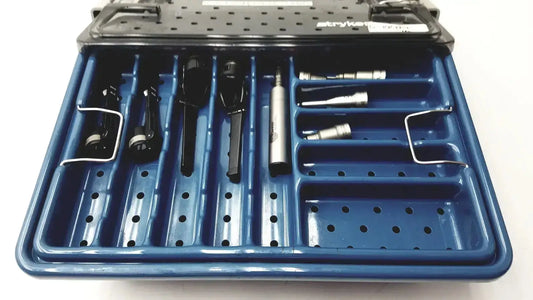 Blue stryker 5400-277 core sterilization case with organized black and metallic surgical tools in compartments for core sterilization