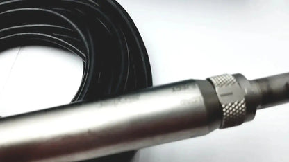Silver-colored metal drill attachment with knurled adjustment ring beside coiled black cable for Stryker core sterilization case