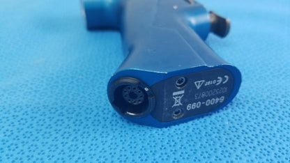 Blue plastic medical equipment air gun with circular nozzle and certification markings on the rear side by smiths medical