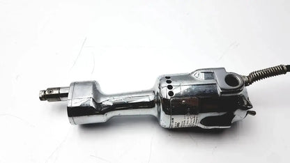 Chrome-finished stryker 8381-210 autopsy saw with textured grip and damaged coiled cord for biomedical technicians