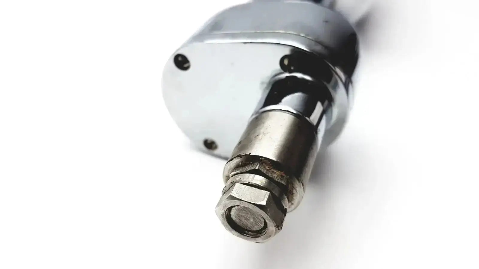 Chrome-finished air compressor nozzle with hexagonal threaded end and bolted housing on the back of stryker 8381-210 autopsy saw hospital surplus for biomedical technicians