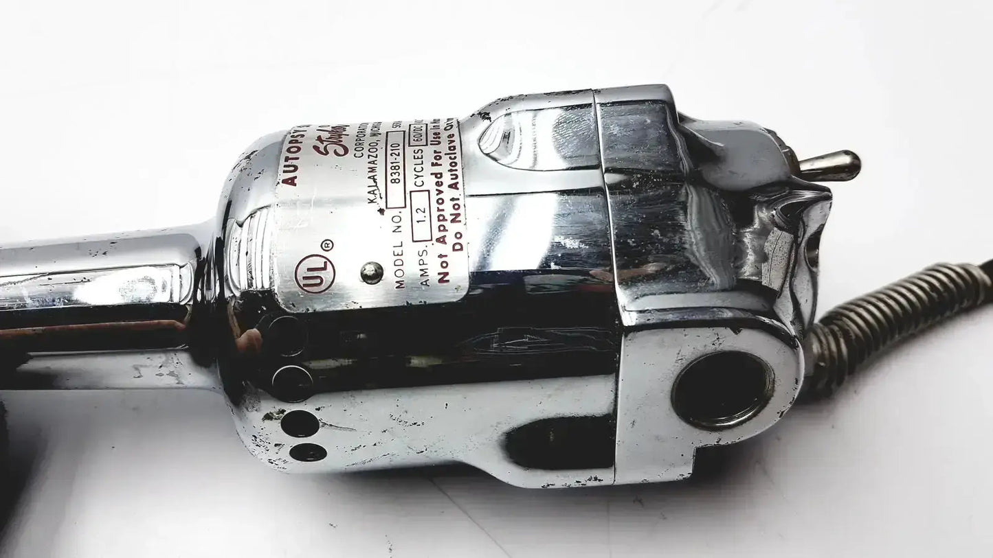 Chrome-finished electric hair clipper with metallic body and branding label featured in used medical equipment for sale