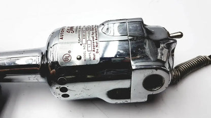 Chrome-finished electric hair clipper with metallic body and branding label featured in used medical equipment for sale