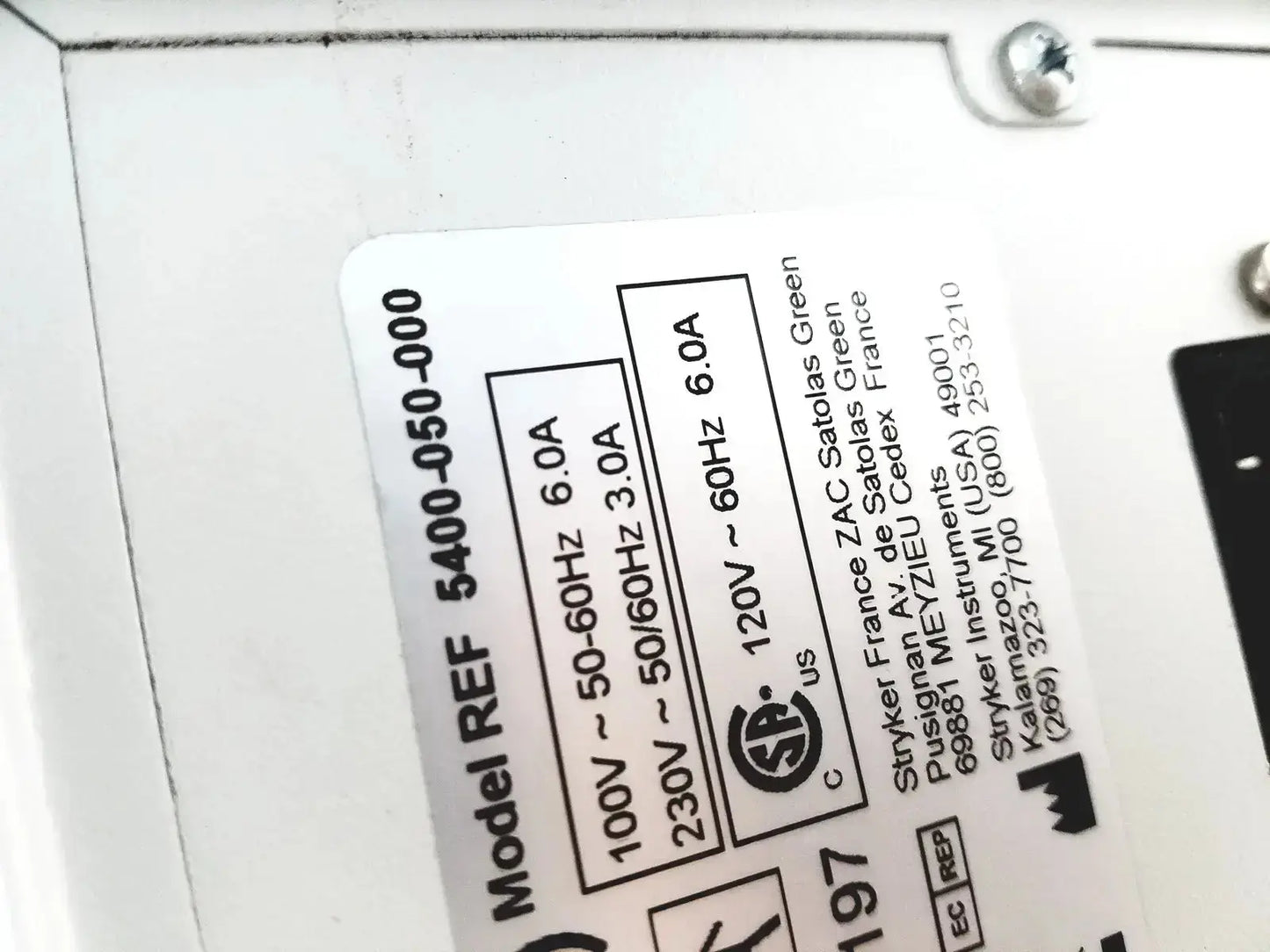 White rectangular label with black text and ul mark showing specifications for stryker coer powered instrument driver