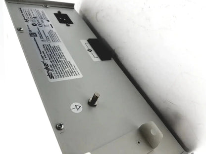 Silver metallic stryker coer powered instrument driver with label screws and a small knob on the back side