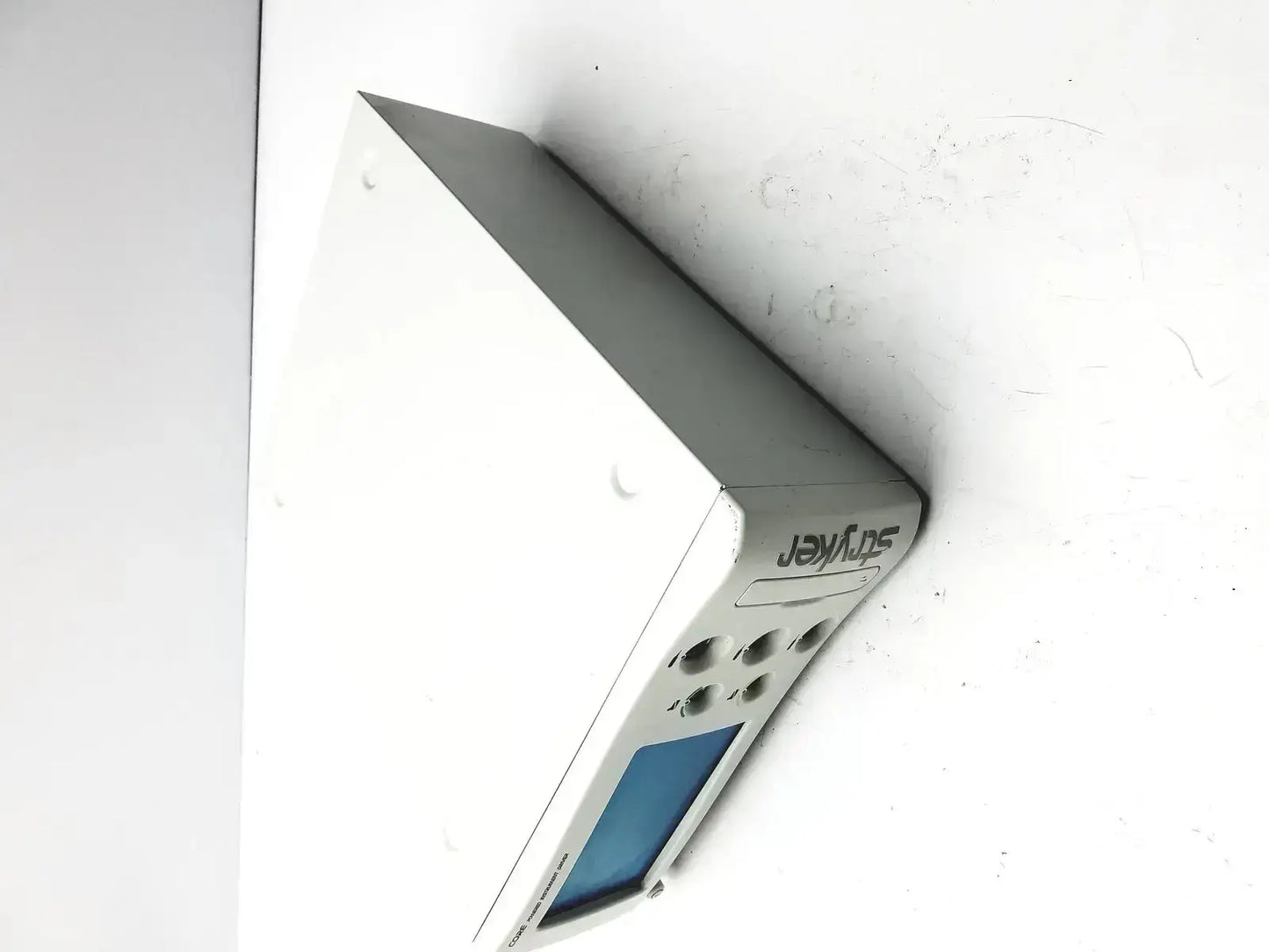Stryker coer powered instrument driver with blue screen and multiple circular ports on the back side in silver jeyfes branding