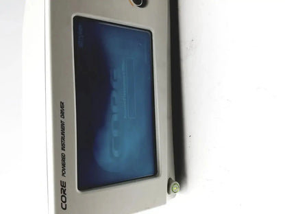 Stryker silver-colored core powered instrument driver with blue-tinted display screen for precise surgical use