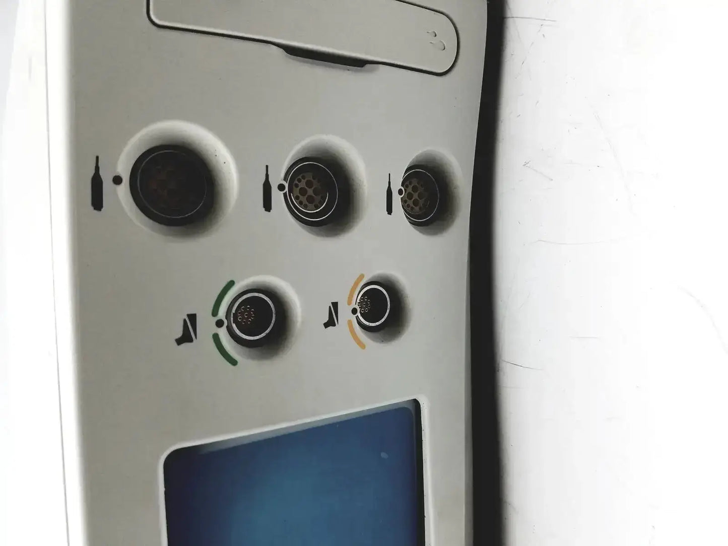 White airplane overhead panel with circular ports and icons for beverage service and seat pitch adjustment on stryker coer powered instrument driver