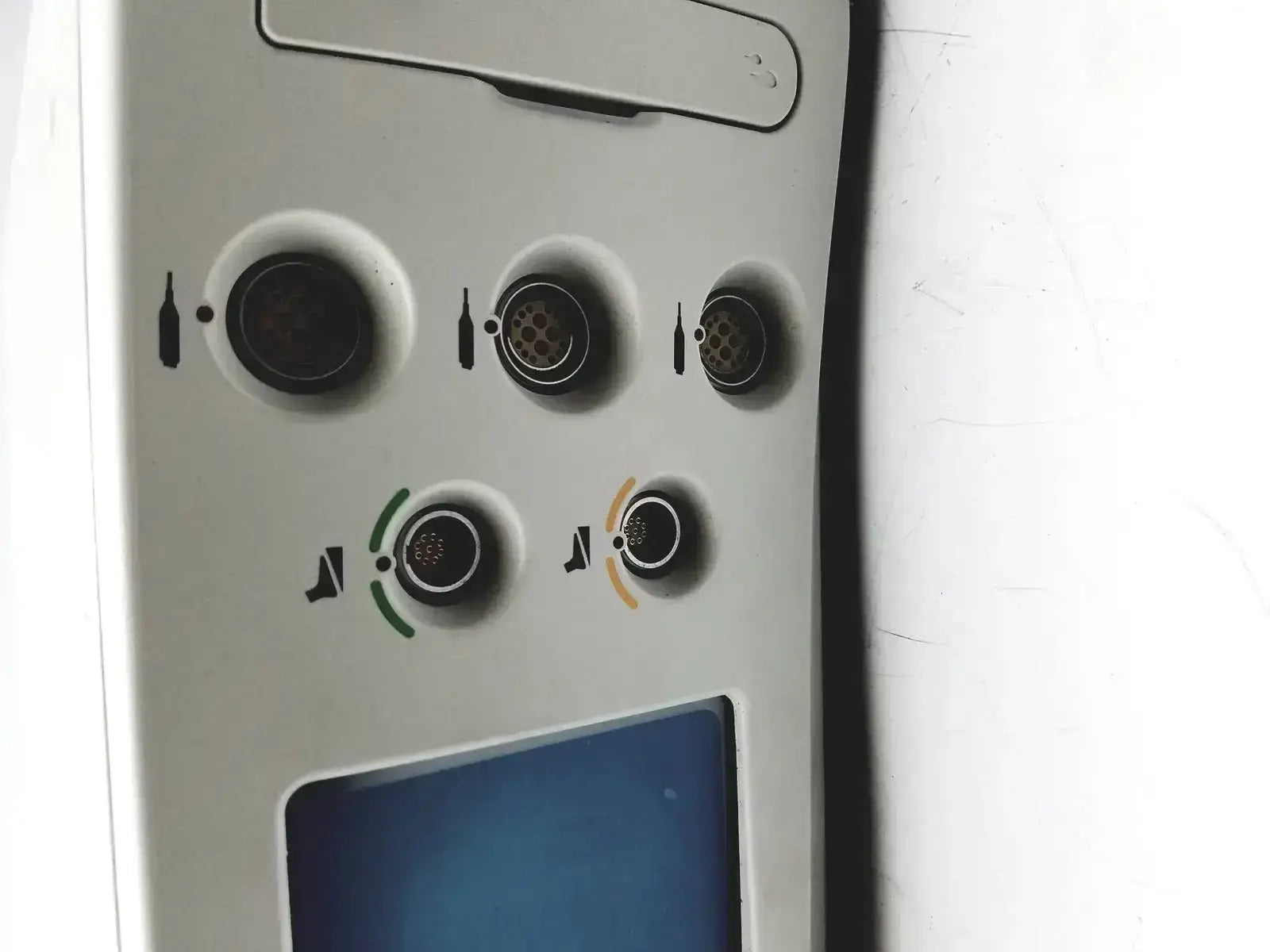 White airplane overhead panel with circular ports and icons for beverage service and seat pitch adjustment on stryker coer powered instrument driver