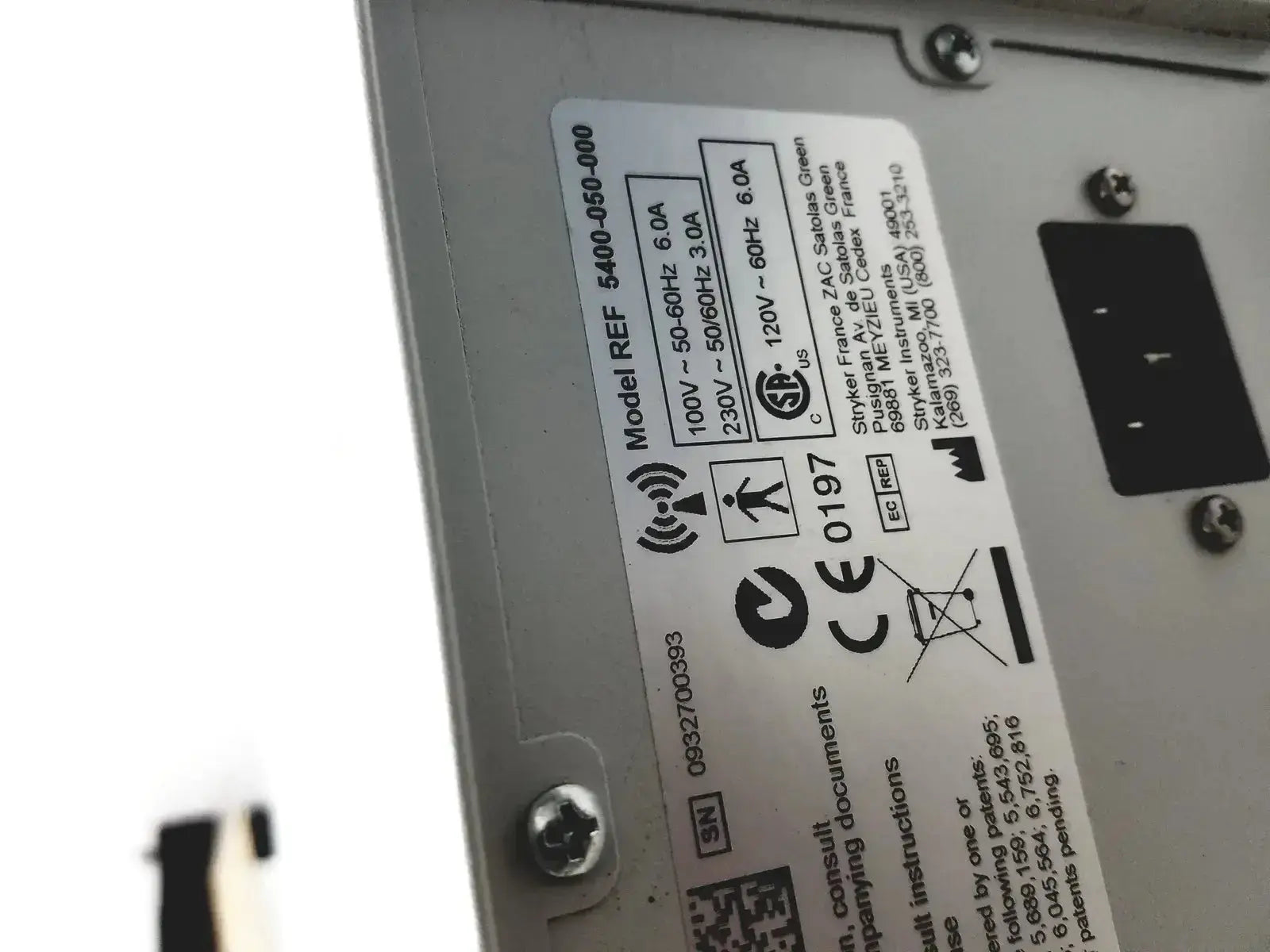 Silver metal powered instrument driver unit with white label model 5400-050-000 and certification logos for stryker