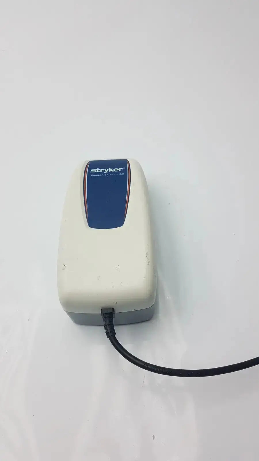Stryker companion pump 2.0 model 2781 compact beige and blue medical-grade air pump with stryker logo on top panel