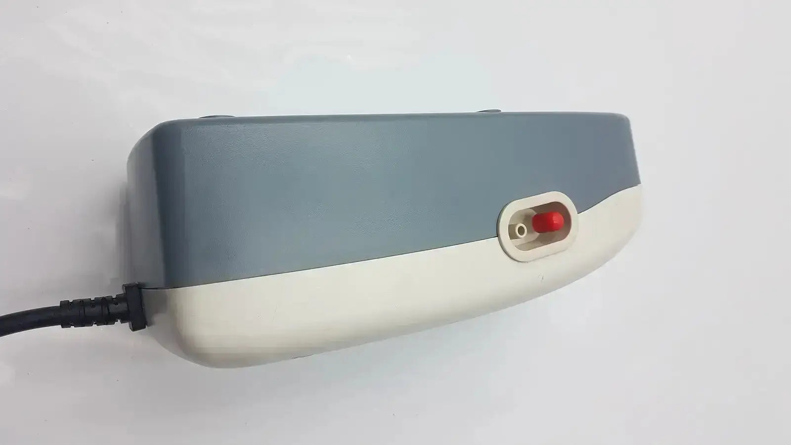 Gray and white two tone plastic stryker companion pump 2.0 model 2781 with red side button for medical use