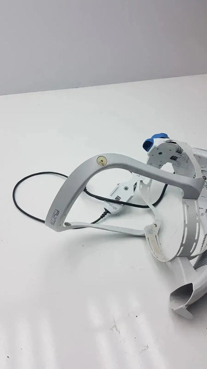 White plastic stryker flyte helmet with blue accents and black cables, model flyte helmet ref 0408-600-000 in dental use